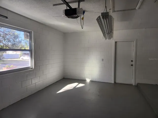 a view of empty room with windows