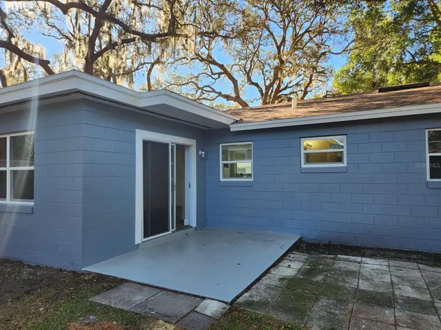 a view of a house with a tree