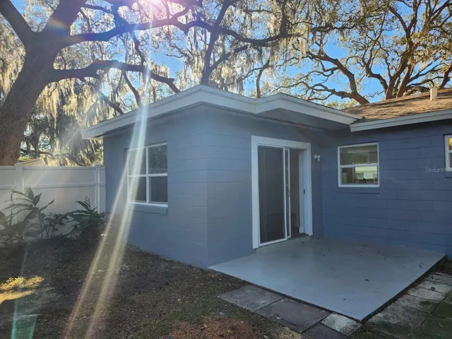 a view of a house with a tree