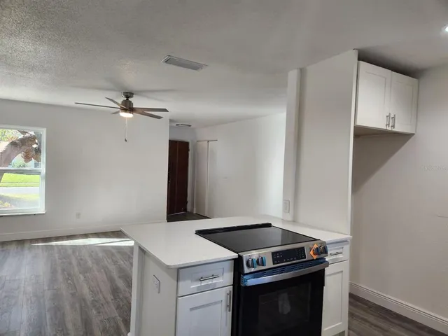 a kitchen with a stove and a sink