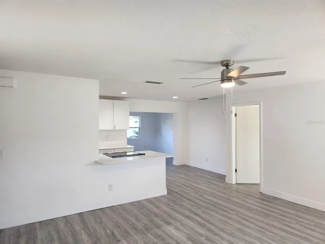 a view of kitchen with wooden floor