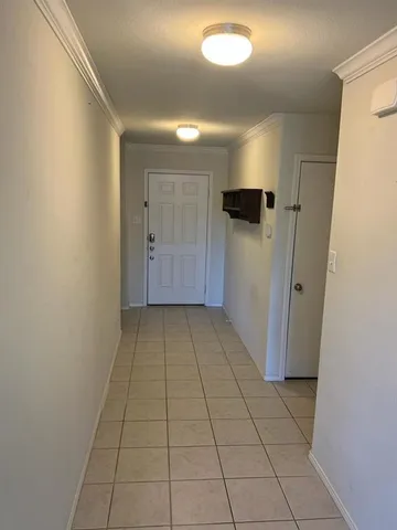 a view of hallway with a window