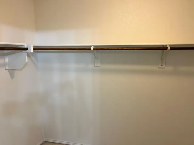 a view of an empty walk in closet