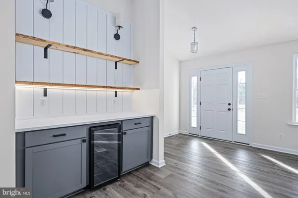 a kitchen with stainless steel appliances a sink stove and microwave
