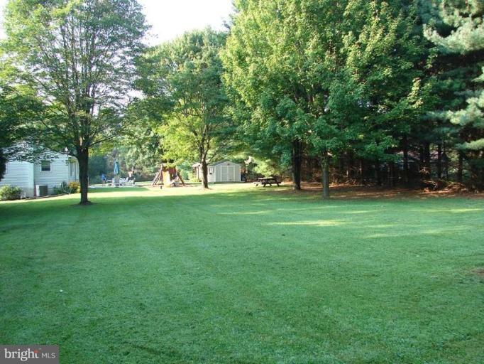 1514 Dulany Road Finksburg, MD 21048 - Photo 4 of 25 Flat Back Yard backs to privacy and shade trees.