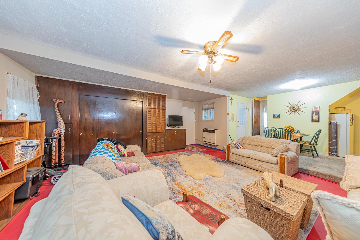 42585 Buckeye Road Oakhurst, CA 93644 - Photo 25 of 55 a bedroom with a bed and a chandelier