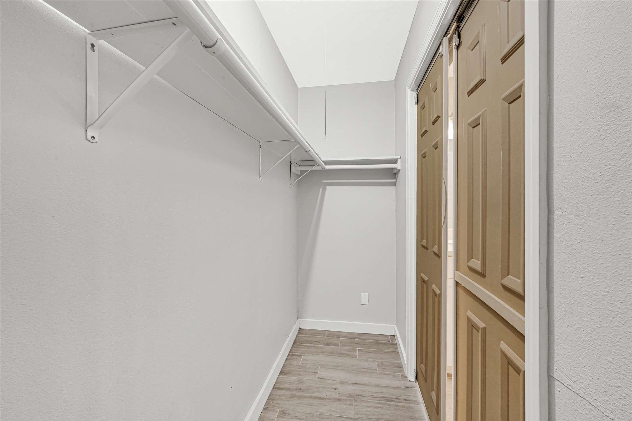 5009 Bataan Road Houston, TX 77033 - Photo 23 of 24 a view of a hallway with wooden floor and entryway