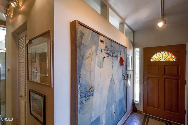 a view of front door with wooden floor