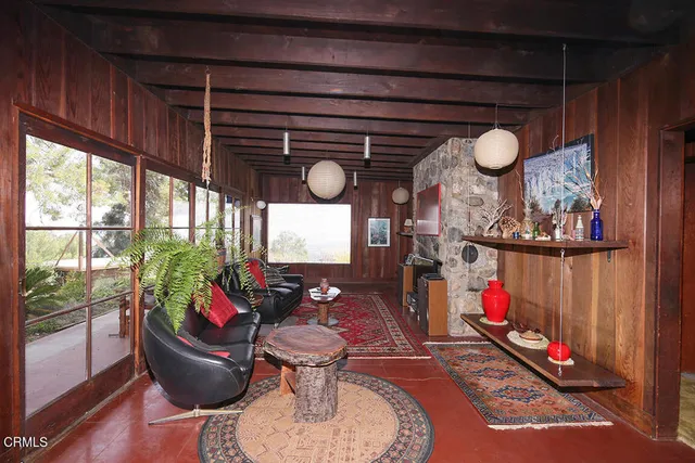 a room with furniture and a large window