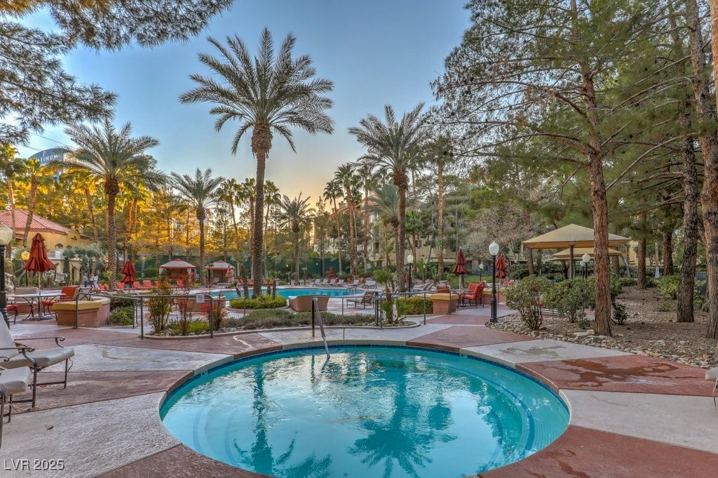 270 East Flamingo Road, Unit 115 Las Vegas, NV 89169 - Photo 1 of 29 Community pool featuring a patio and a gazebo