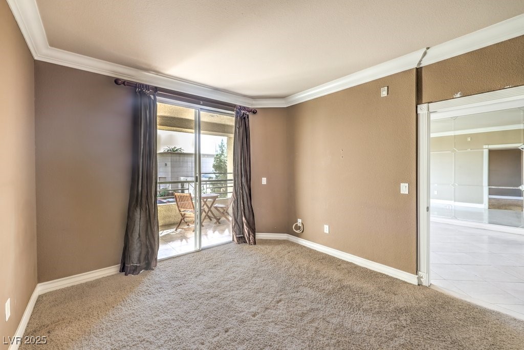 270 East Flamingo Road, Unit 115 Las Vegas, NV 89169 - Photo 16 of 29 Spare room with crown molding and carpet