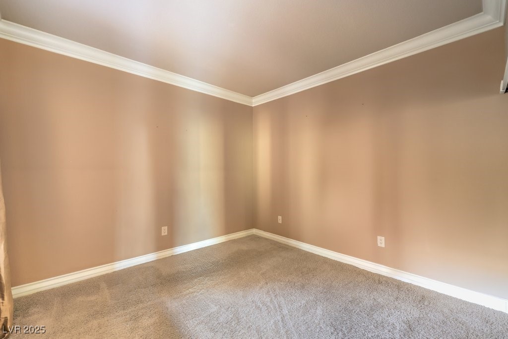 270 East Flamingo Road, Unit 115 Las Vegas, NV 89169 - Photo 20 of 29 Carpeted empty room with crown molding and baseboards