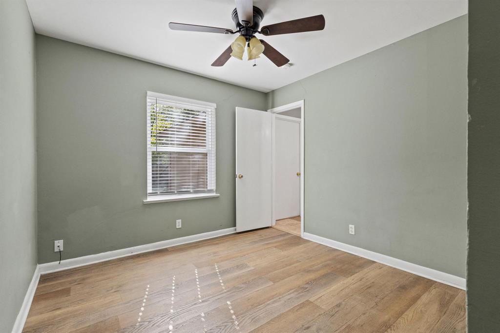 1704 West Birge Street Sherman, TX 75092 - Photo 11 of 23 a view of a room with a ceiling fan and a window