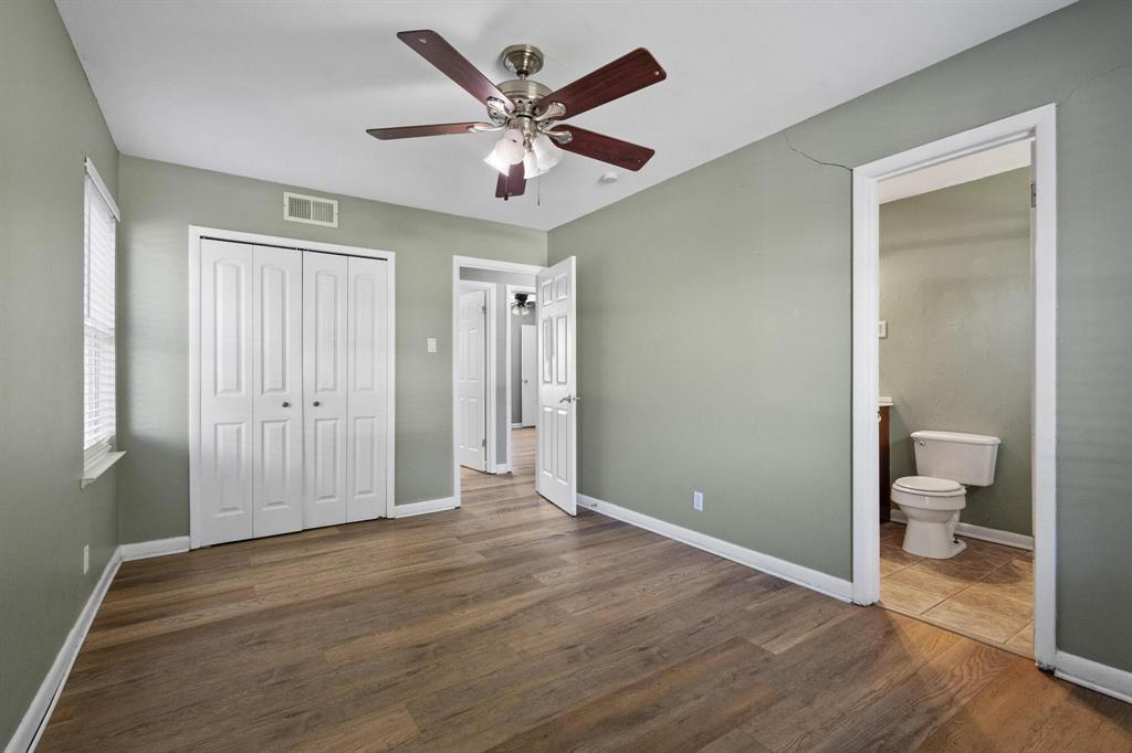 1704 West Birge Street Sherman, TX 75092 - Photo 17 of 23 a view of a room with wooden floor and a ceiling fan