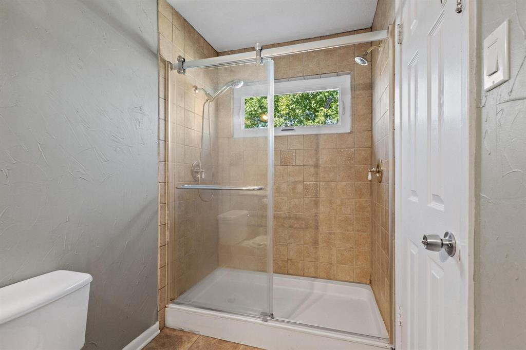 1704 West Birge Street Sherman, TX 75092 - Photo 19 of 23 a bathroom with a shower and toilet