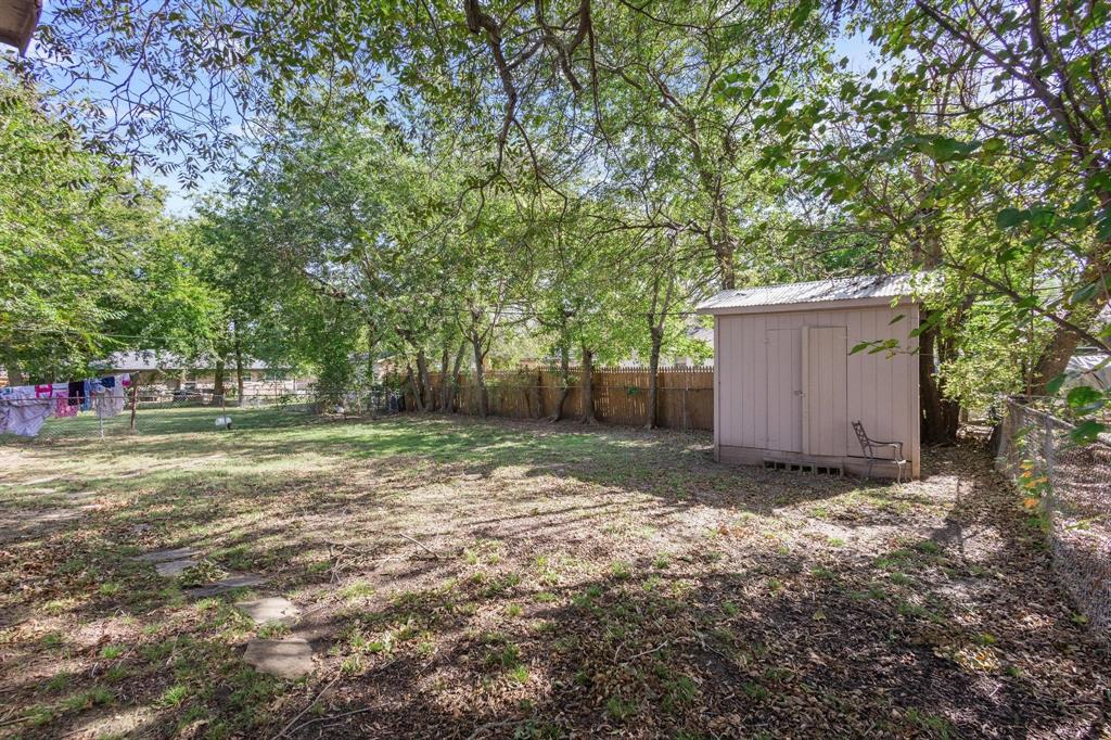 1704 West Birge Street Sherman, TX 75092 - Photo 21 of 23 a backyard of a house with lots of green space