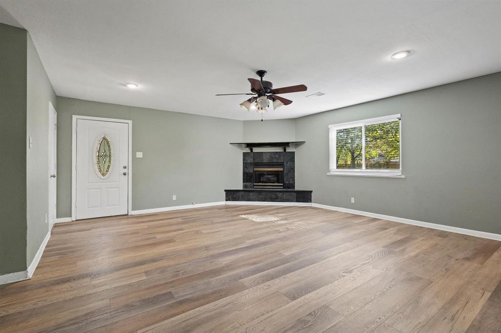 1704 West Birge Street Sherman, TX 75092 - Photo 8 of 23 a view of empty room with a window and a ceiling fan
