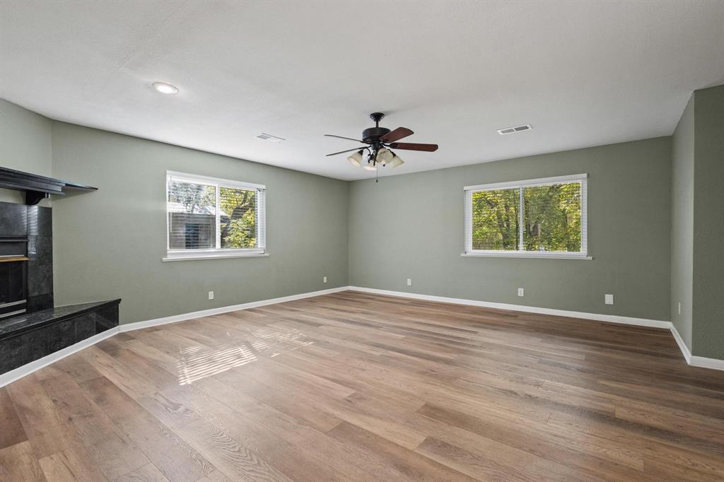 1704 West Birge Street Sherman, TX 75092 - Photo 10 of 23 a view of an empty room with a window and a ceiling fan