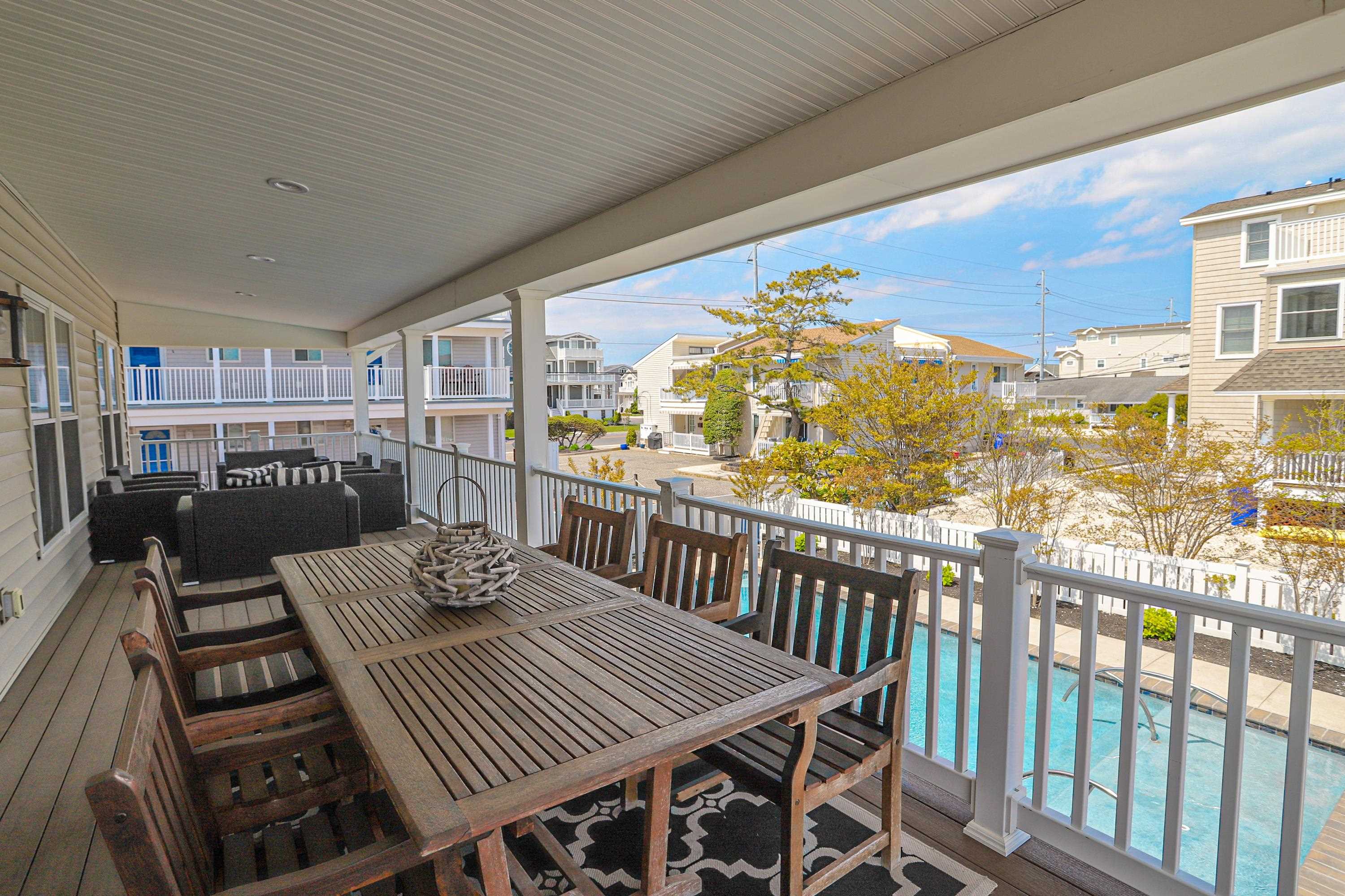 285 78th Street Avalon, NJ 08202 - Photo 19 of 48 a view of a balcony dining area with furniture