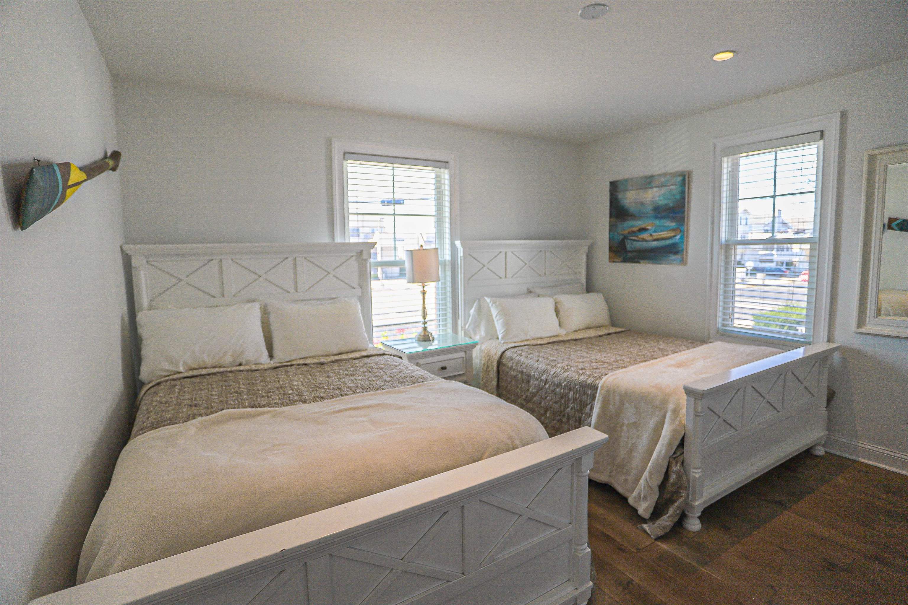 285 78th Street Avalon, NJ 08202 - Photo 21 of 48 a bedroom with two beds and a window