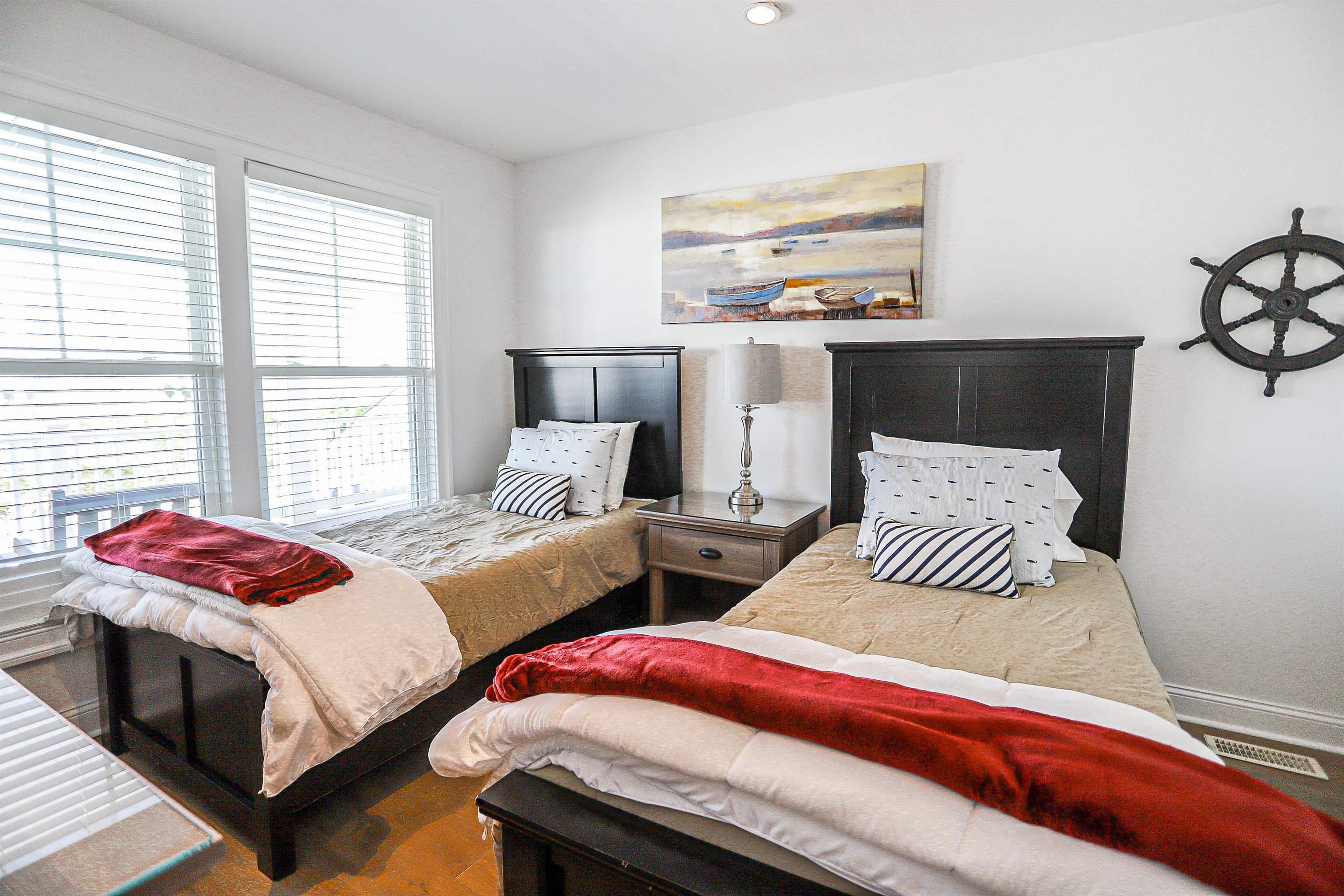 285 78th Street Avalon, NJ 08202 - Photo 26 of 48 a bedroom with two beds and painting on the wall