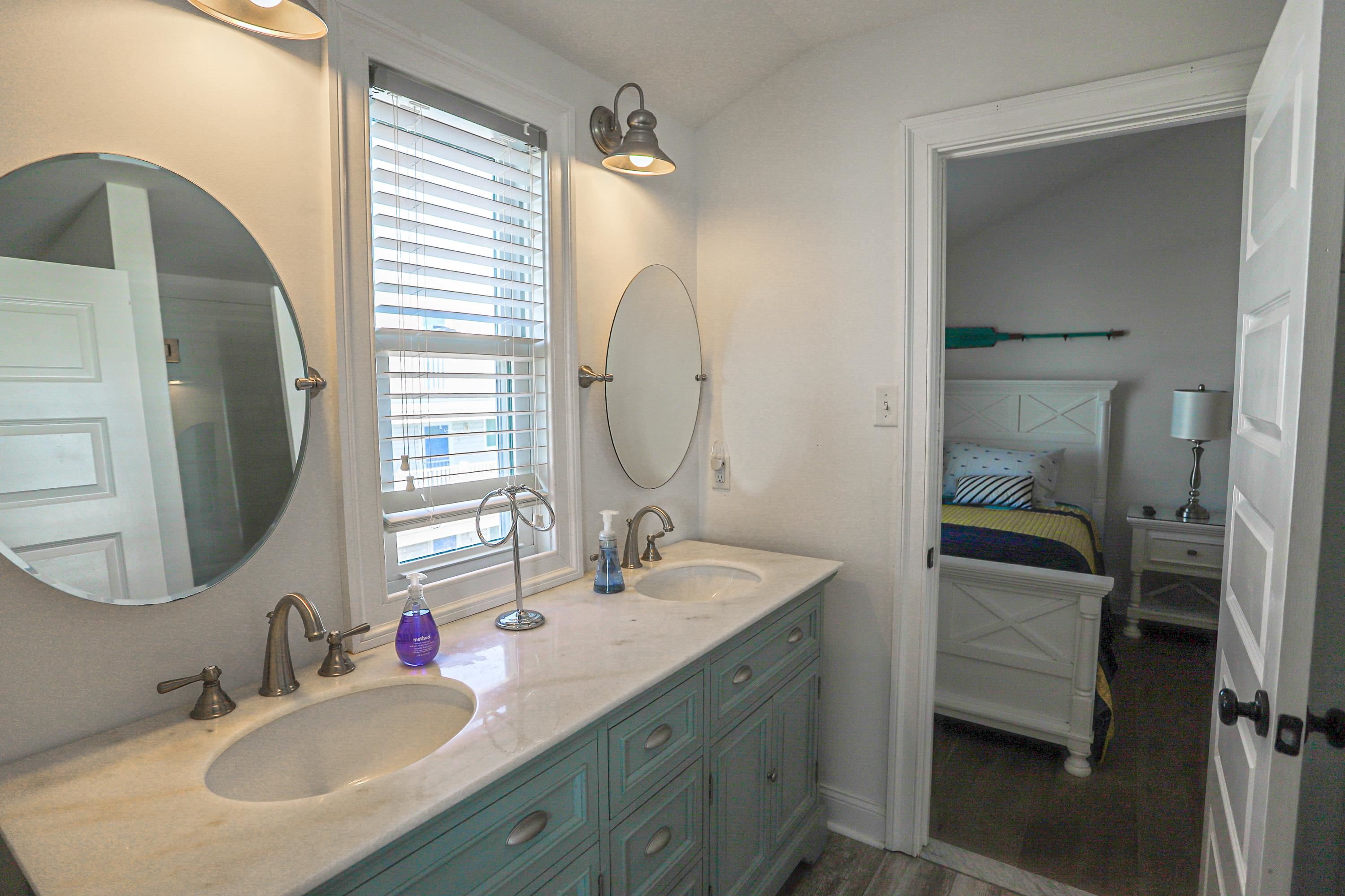 285 78th Street Avalon, NJ 08202 - Photo 29 of 48 a bathroom with a double vanity sink and a mirror