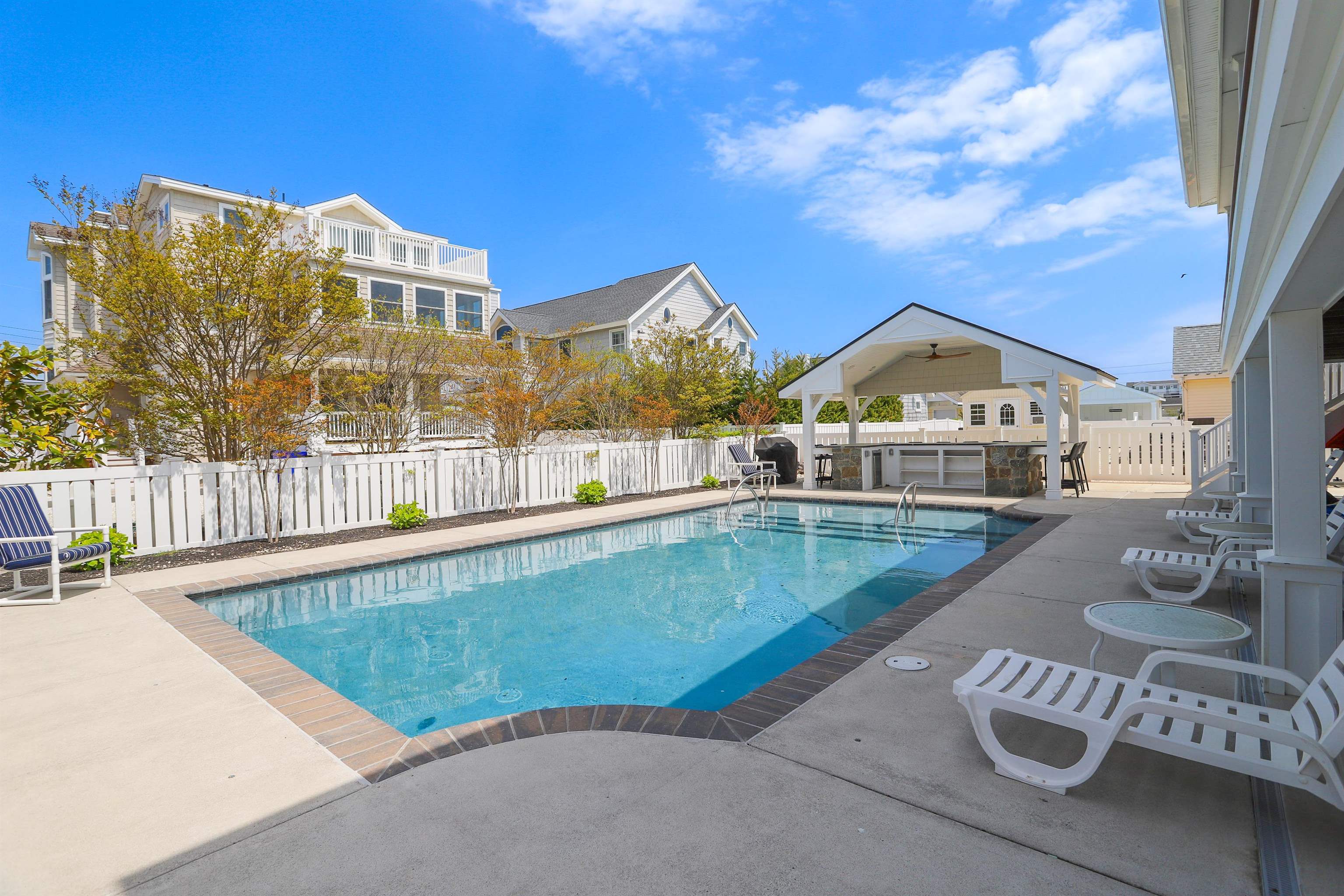 285 78th Street Avalon, NJ 08202 - Photo 40 of 48 a view of a house with swimming pool and sitting area