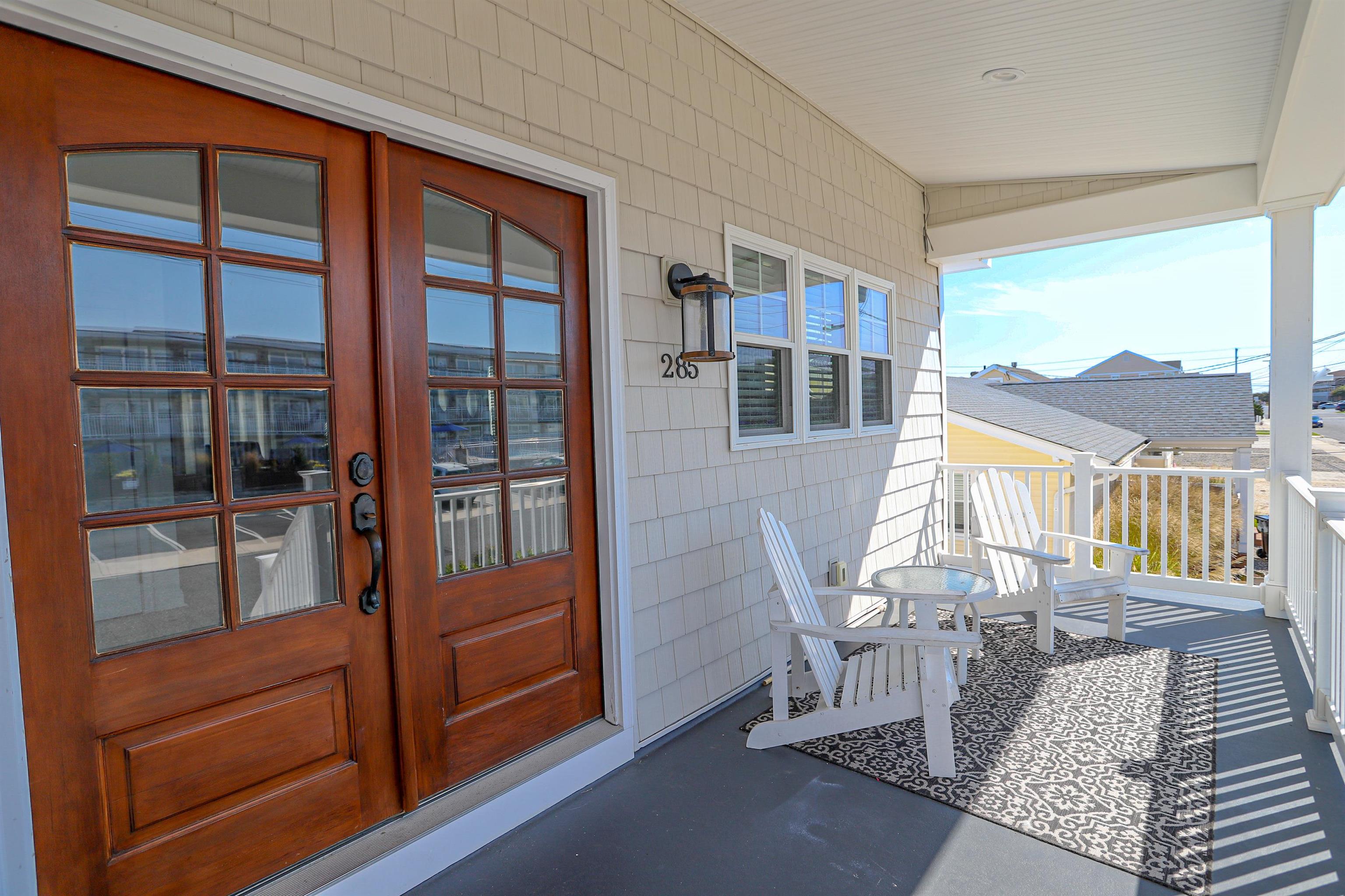 285 78th Street Avalon, NJ 08202 - Photo 4 of 48 a view of a living room and a balcony with furniture