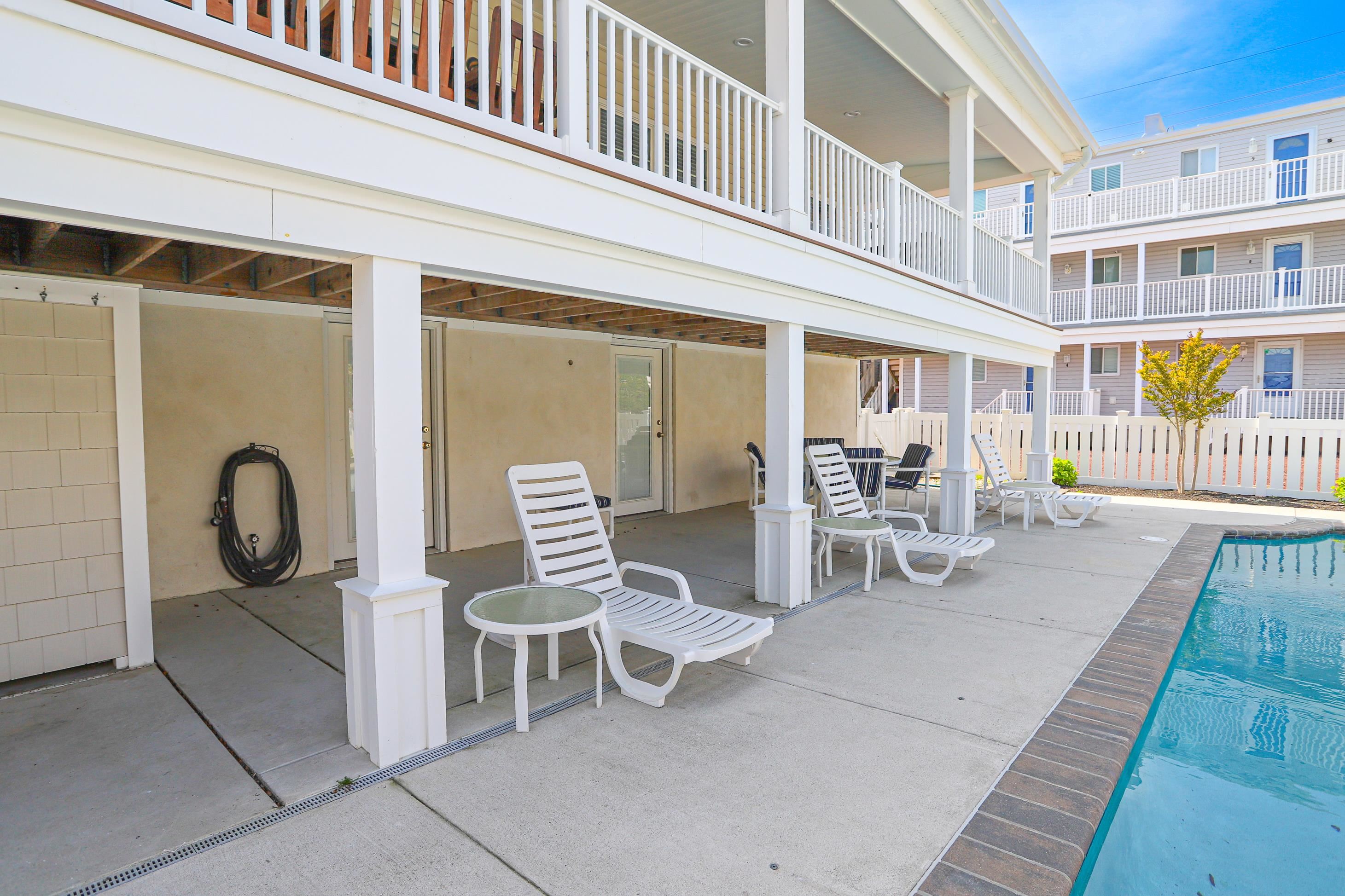 285 78th Street Avalon, NJ 08202 - Photo 41 of 48 a view of a patio with a table and chairs