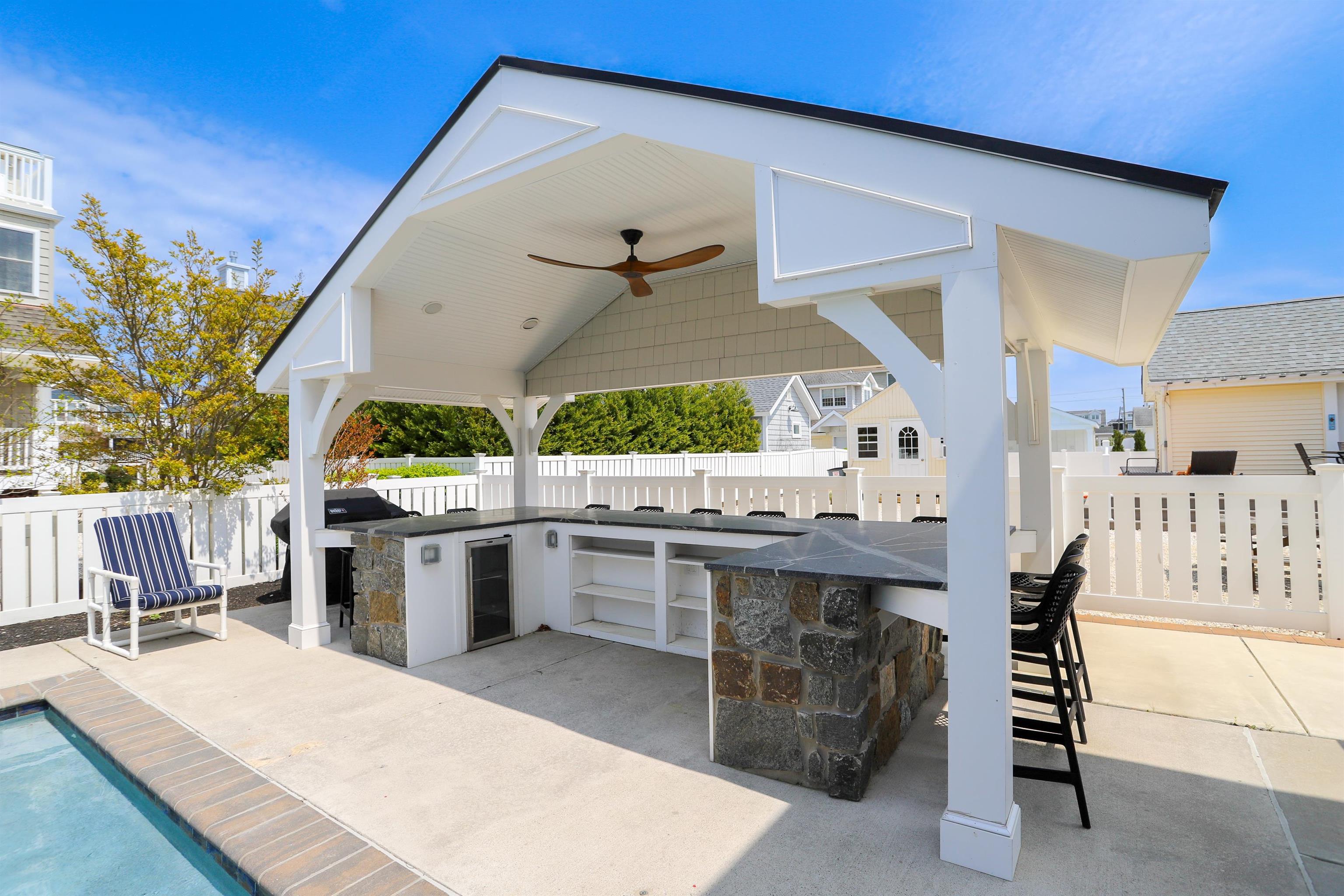 285 78th Street Avalon, NJ 08202 - Photo 42 of 48 a kitchen with a table and chairs in it
