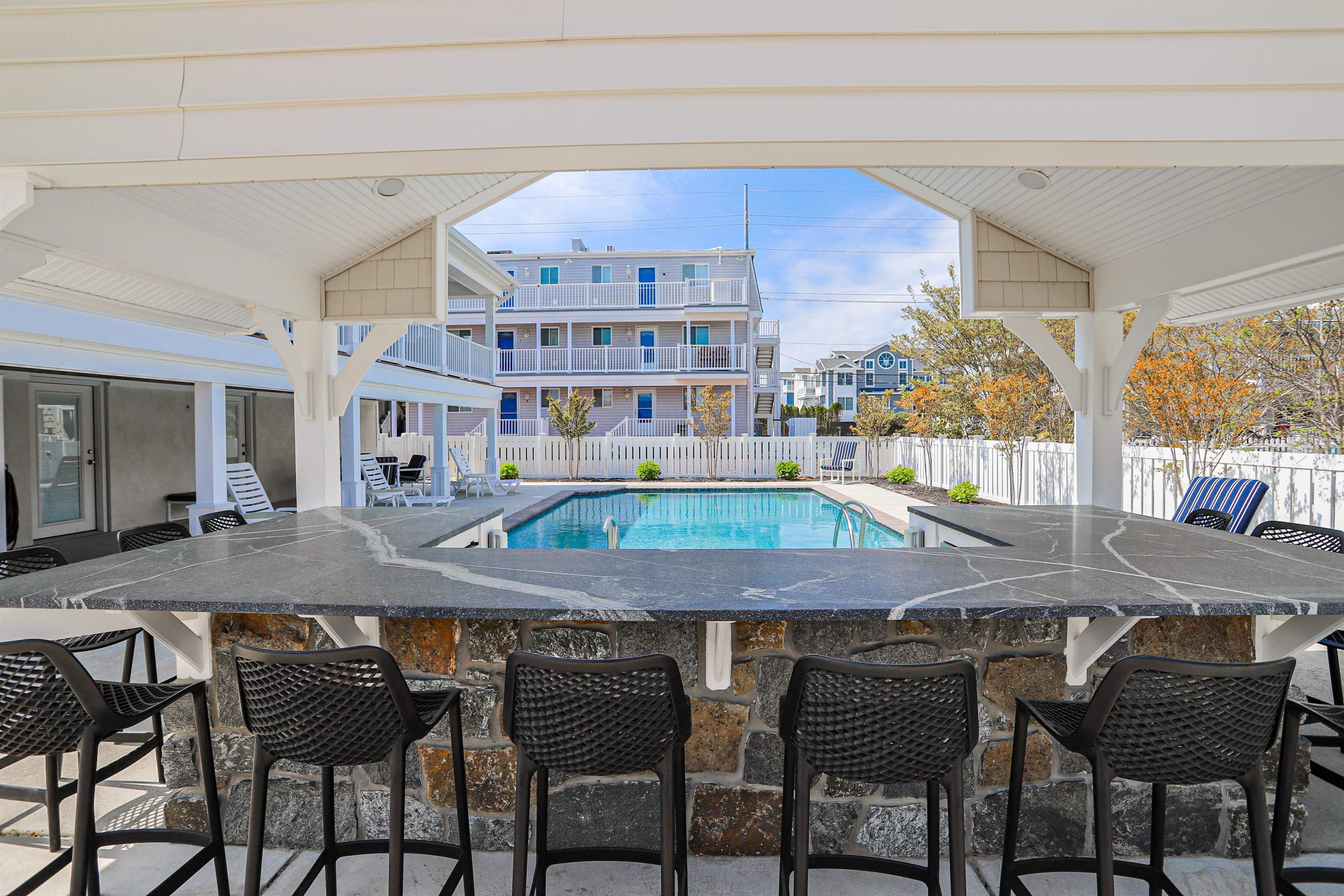 285 78th Street Avalon, NJ 08202 - Photo 43 of 48 a table and chairs with the wooden floor