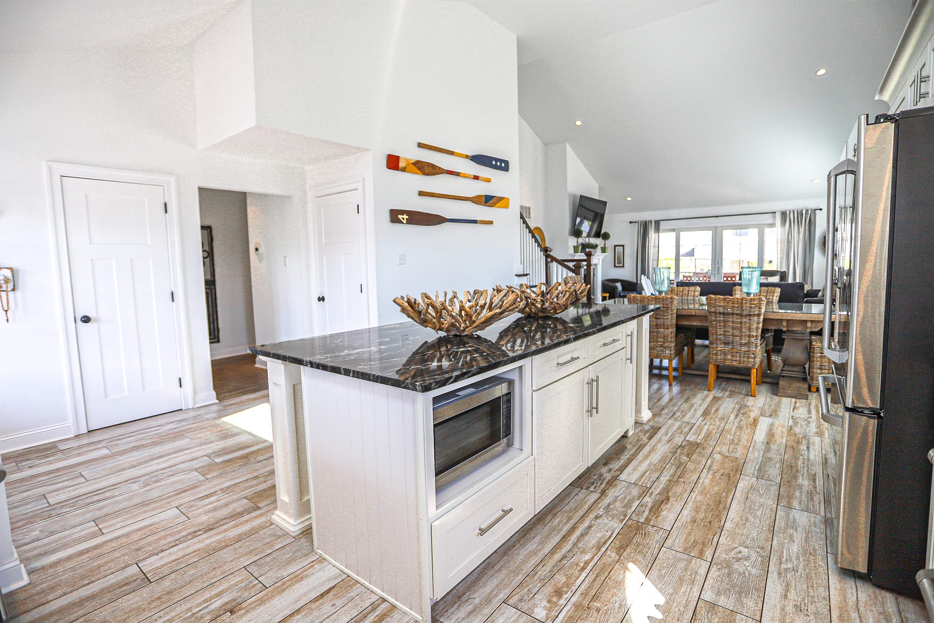 285 78th Street Avalon, NJ 08202 - Photo 9 of 48 a kitchen with stainless steel appliances a stove a sink and a refrigerator