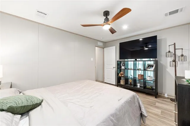 a white toilet sitting next to a bathroom sink and tub