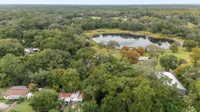 a view of a lake with huge green field