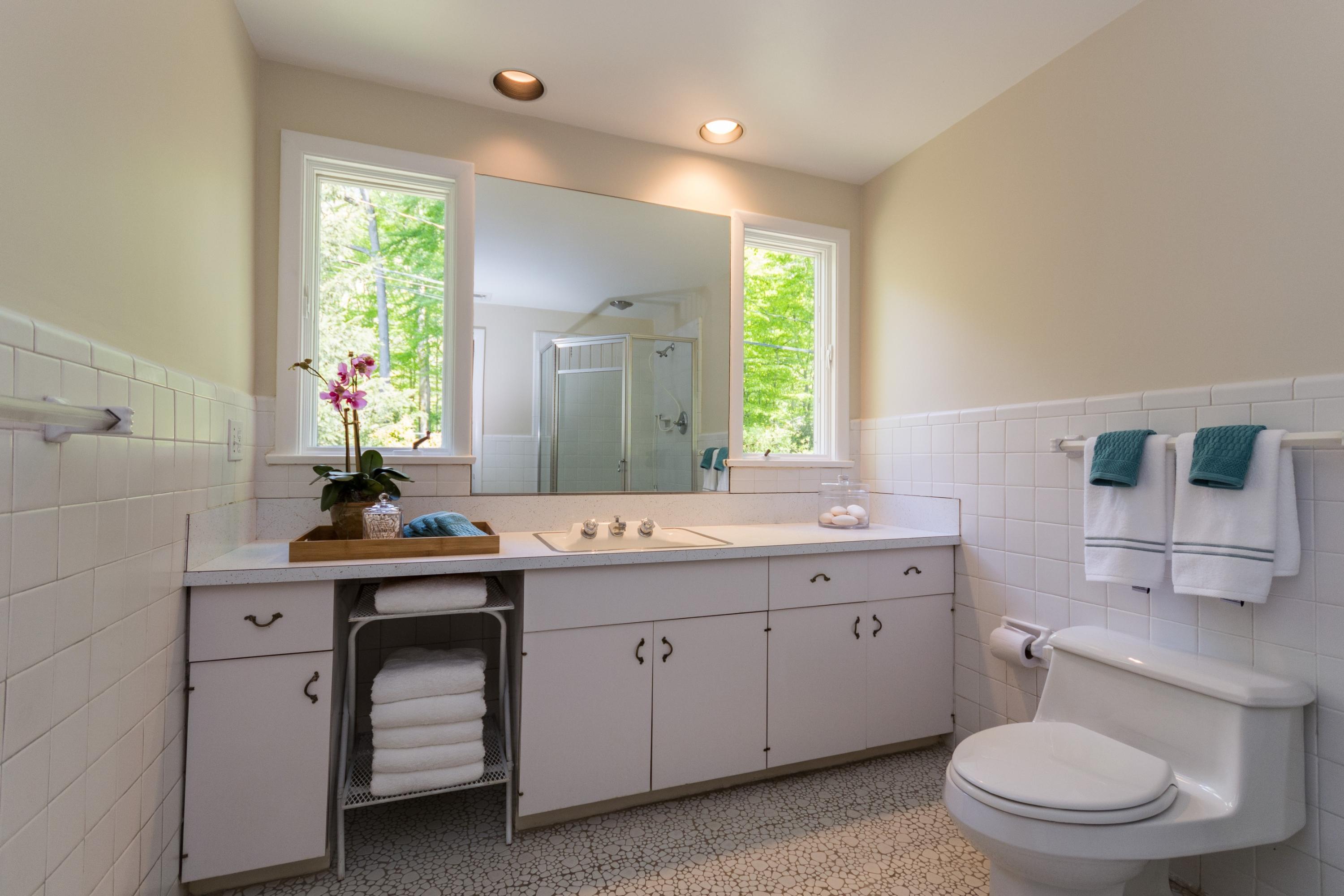 145 Middlesex Road Darien, CT 06820 - Photo 12 of 23 a spacious bathroom with a toilet sink and mirror