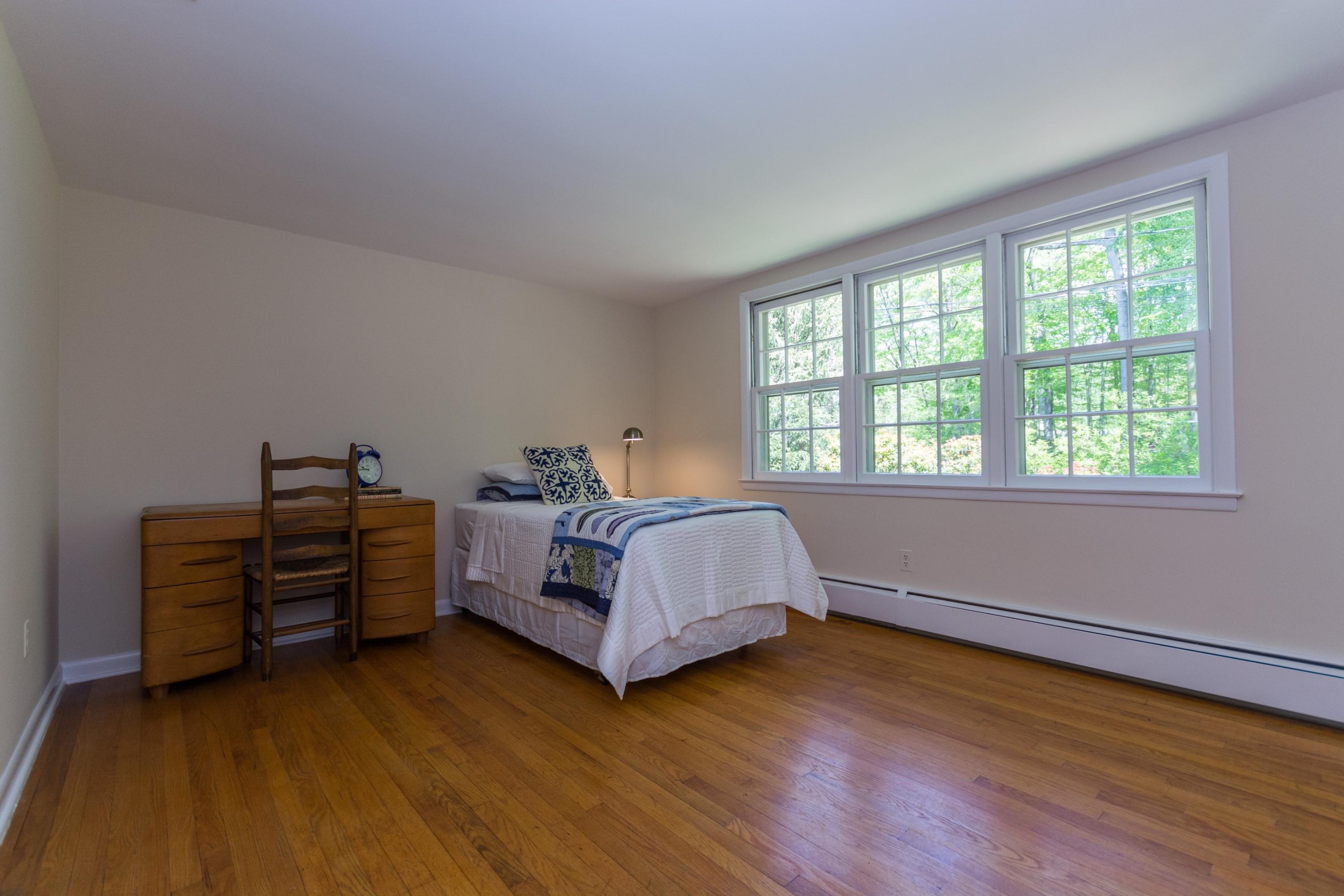 145 Middlesex Road Darien, CT 06820 - Photo 13 of 23 a bed room with furniture and a window