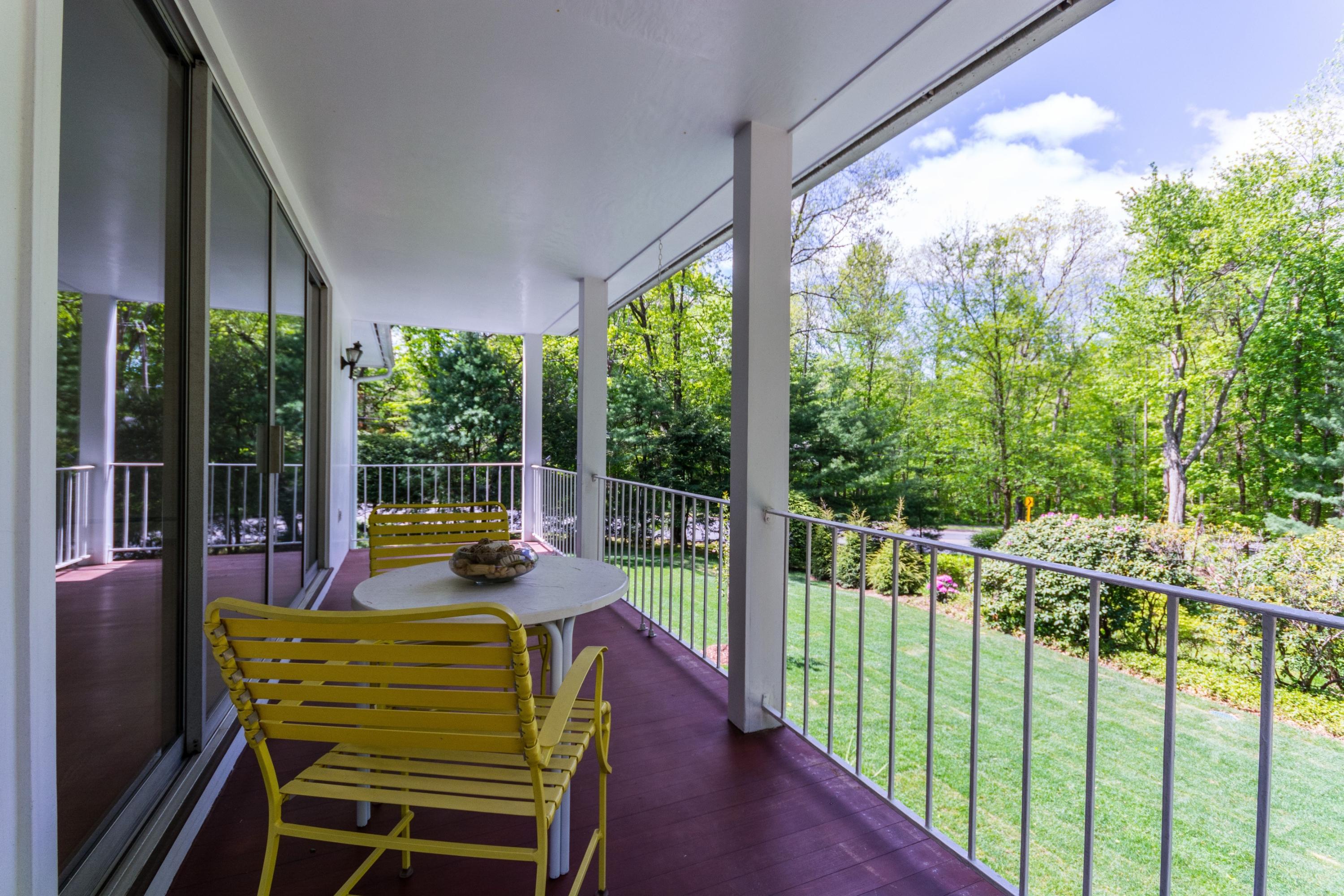145 Middlesex Road Darien, CT 06820 - Photo 19 of 23 a view of a chairs and table in the balcony