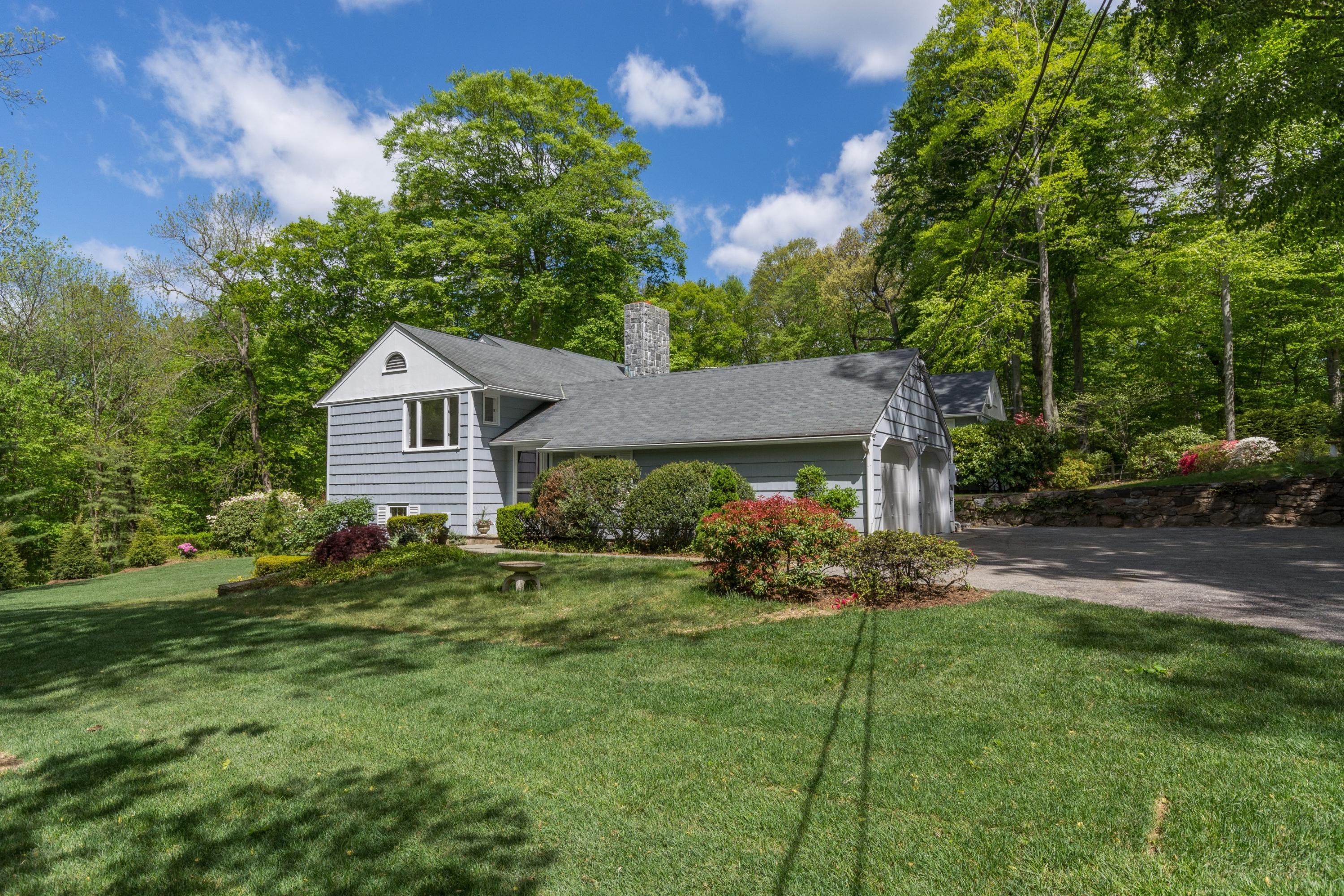 145 Middlesex Road Darien, CT 06820 - Photo 3 of 23 a front view of a house with garden