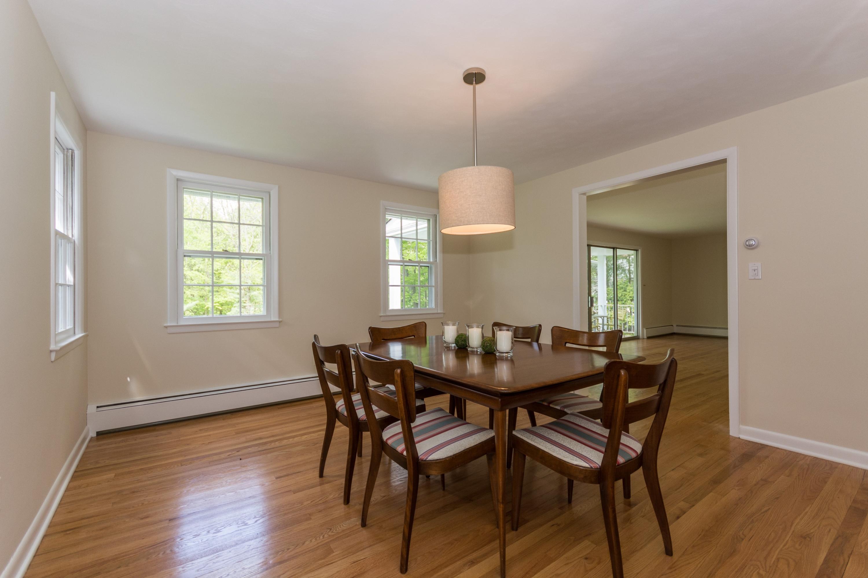 145 Middlesex Road Darien, CT 06820 - Photo 7 of 23 a view of a dining room and a table chairs