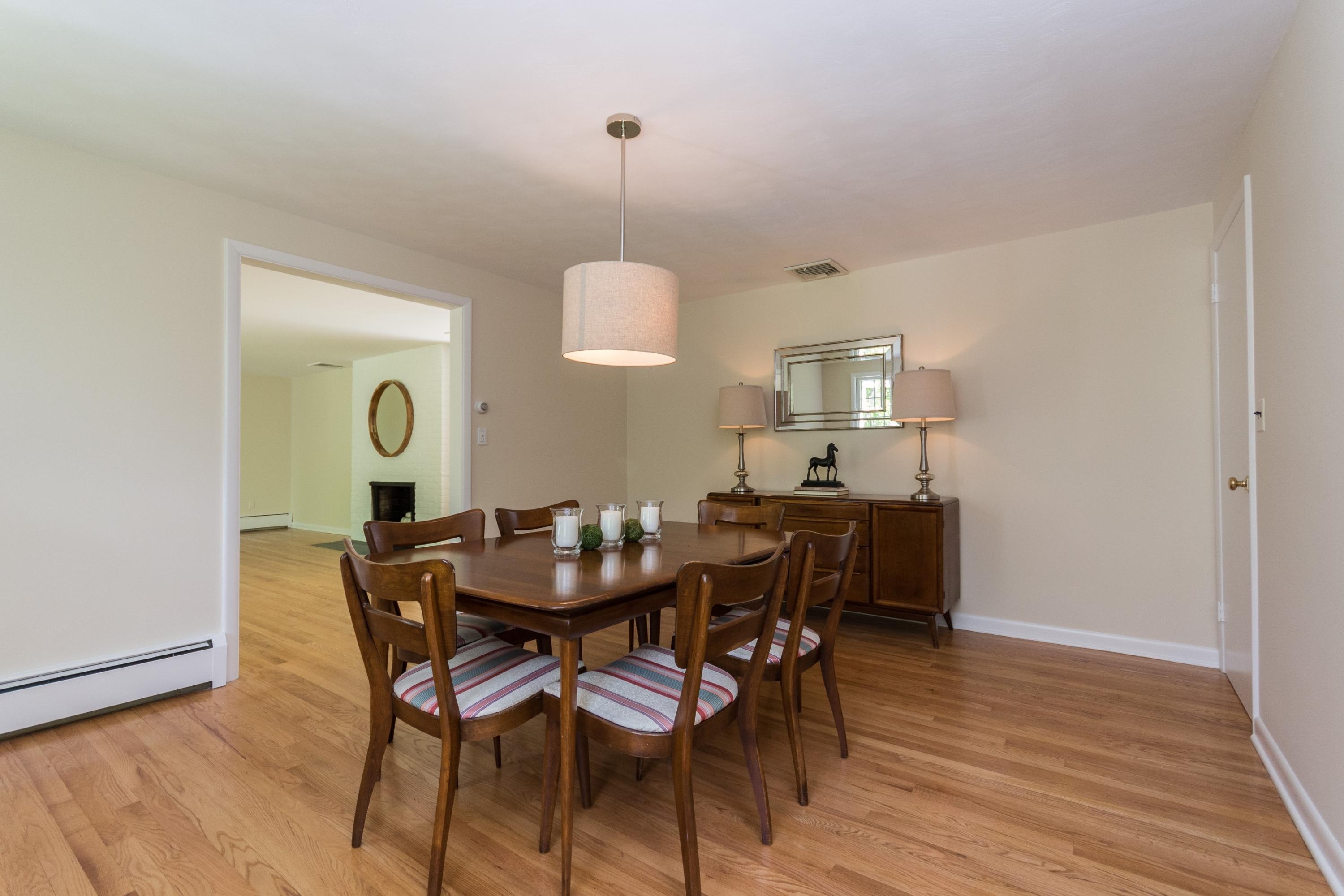 145 Middlesex Road Darien, CT 06820 - Photo 8 of 23 a view of a dining room with furniture and wooden floor