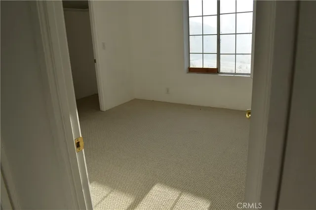a kitchen with a stove and a refrigerator
