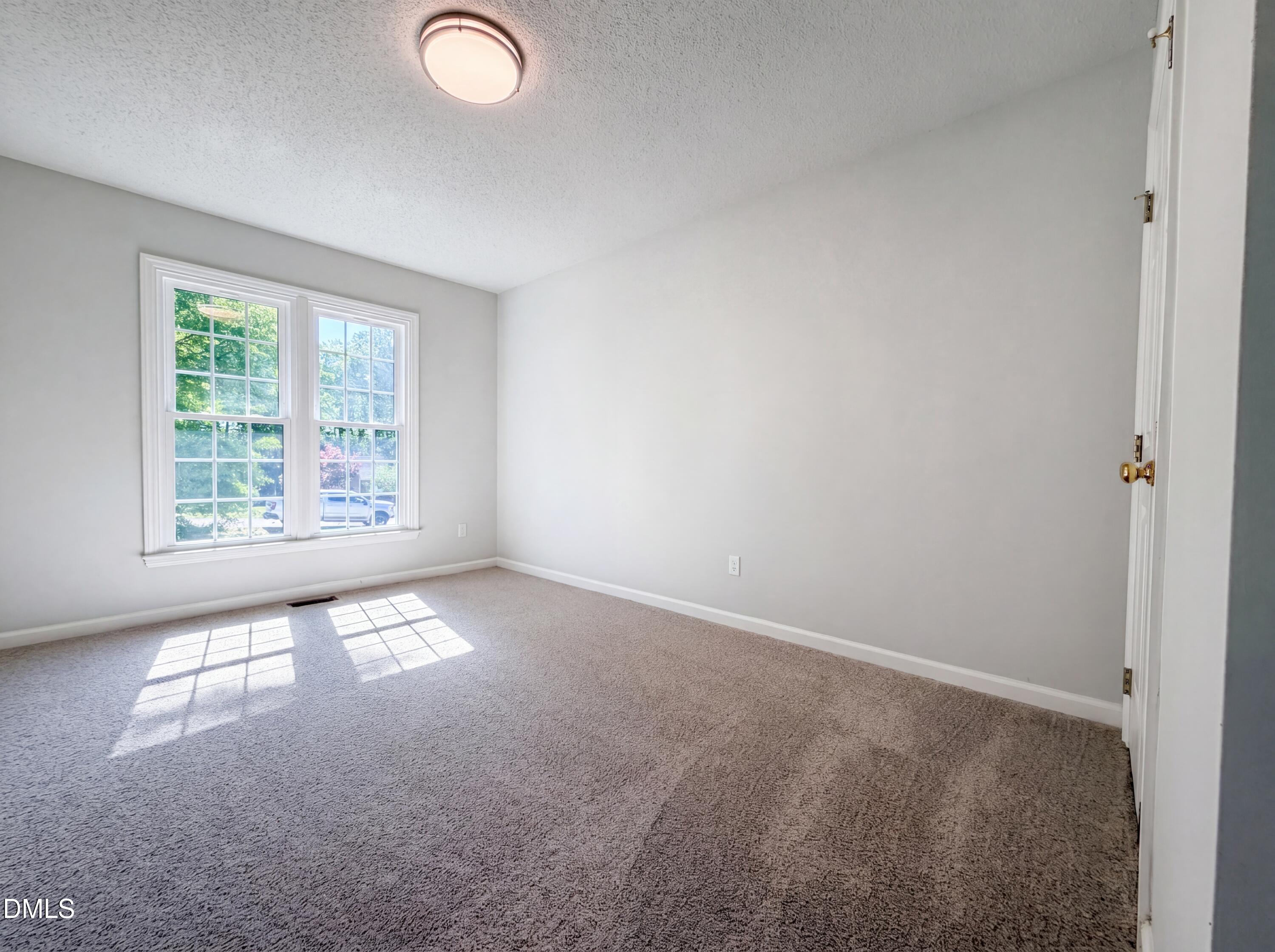 765 Trebor Drive Garner, NC 27529 - Photo 16 of 27 an empty room with windows