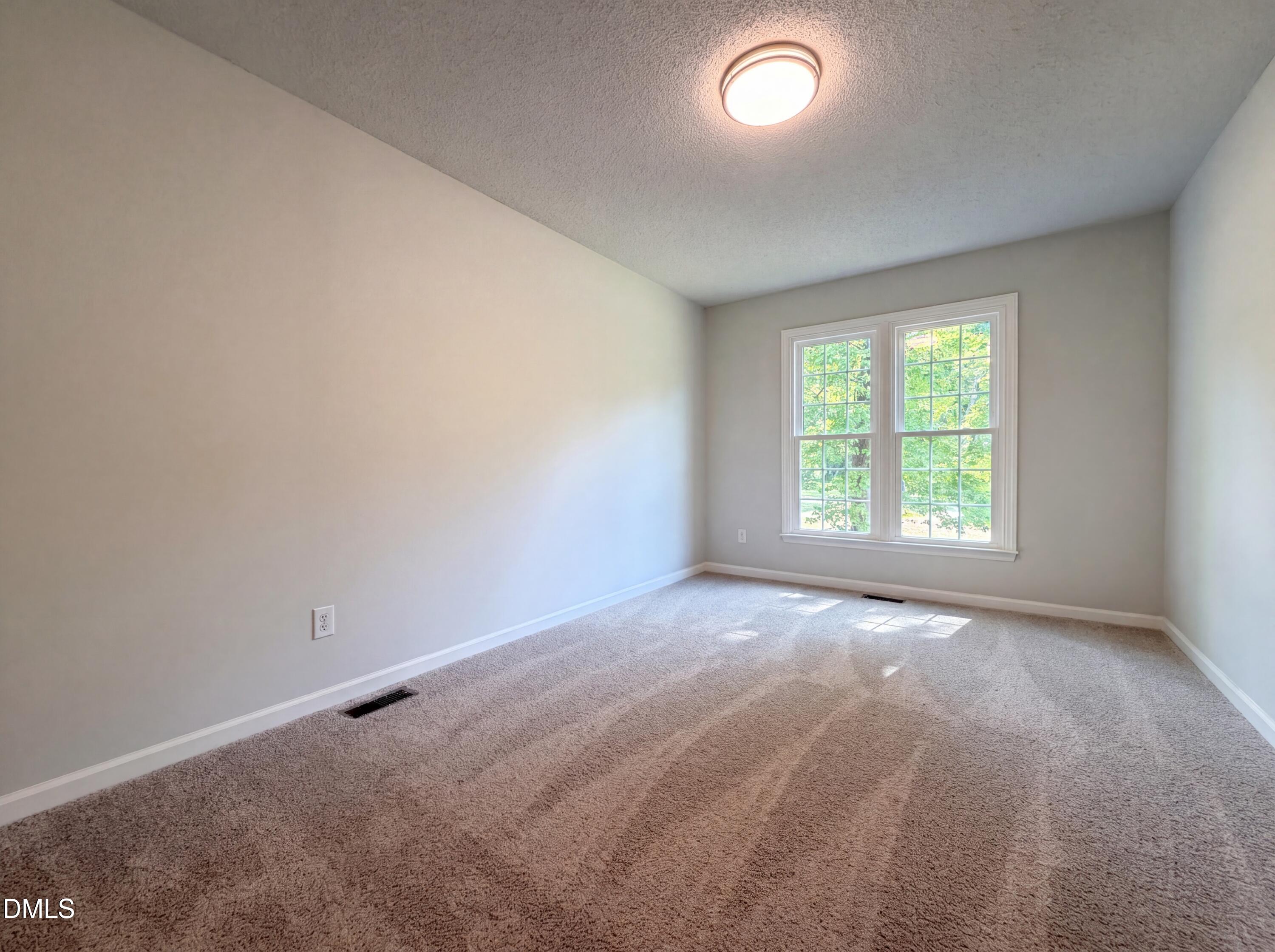 765 Trebor Drive Garner, NC 27529 - Photo 17 of 27 an empty room with a window