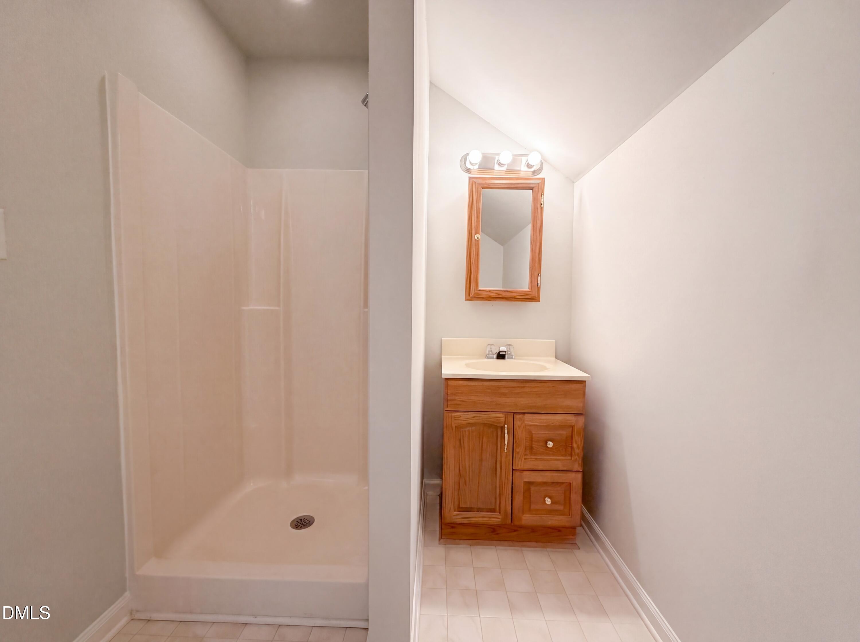 765 Trebor Drive Garner, NC 27529 - Photo 21 of 27 a bathroom with a sink and a mirror