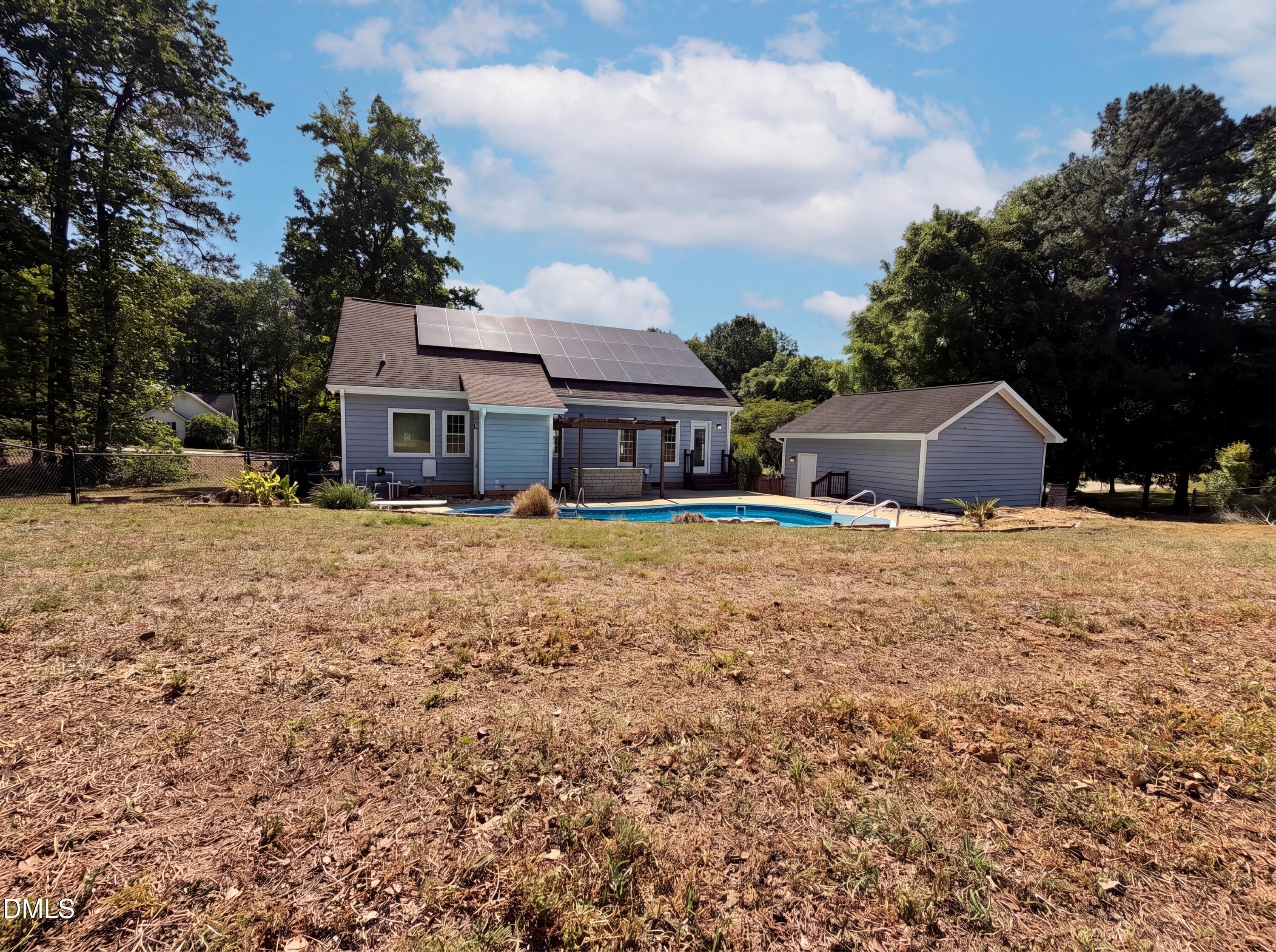 765 Trebor Drive Garner, NC 27529 - Photo 26 of 27 a front view of a house with a yard covered with snow and trees