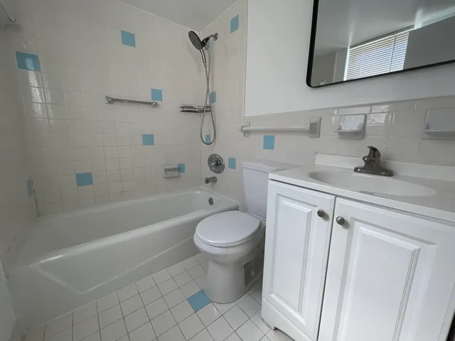 a bathroom with a sink a toilet and a bathtub