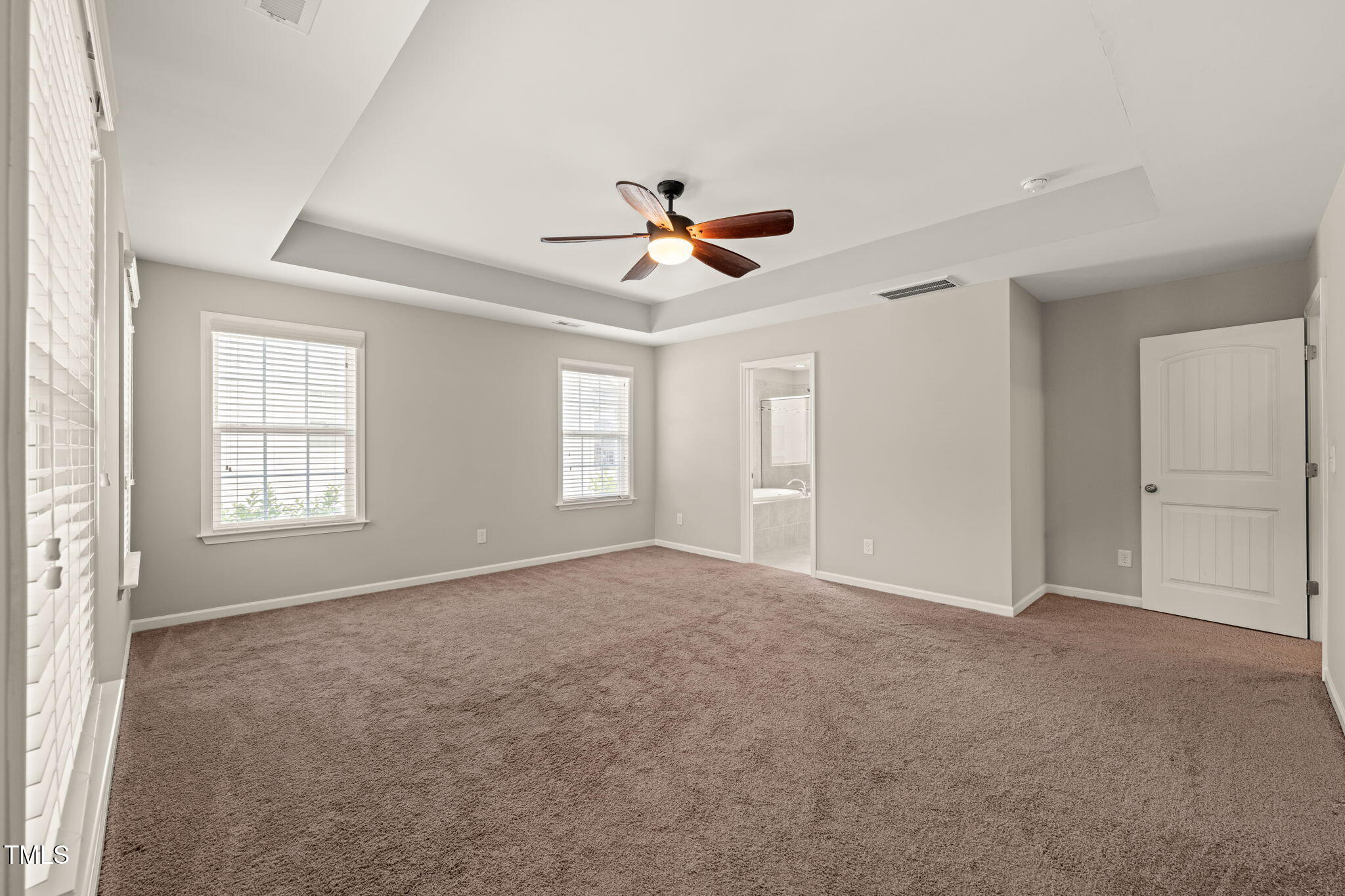 5011 Peachtree Town Lane Knightdale, NC 27545 - Photo 25 of 47 wooden floor in an empty room with a window