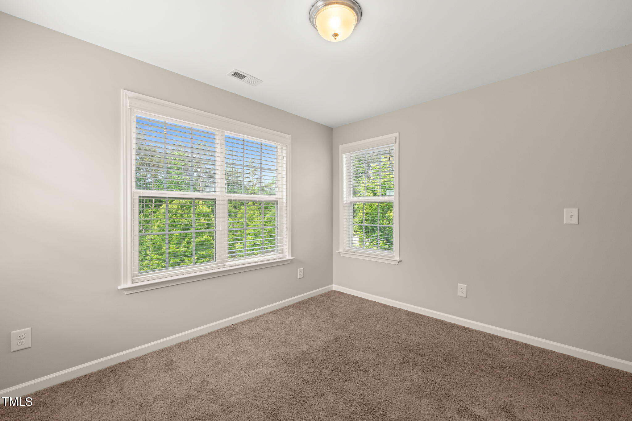 5011 Peachtree Town Lane Knightdale, NC 27545 - Photo 26 of 47 an empty room with windows