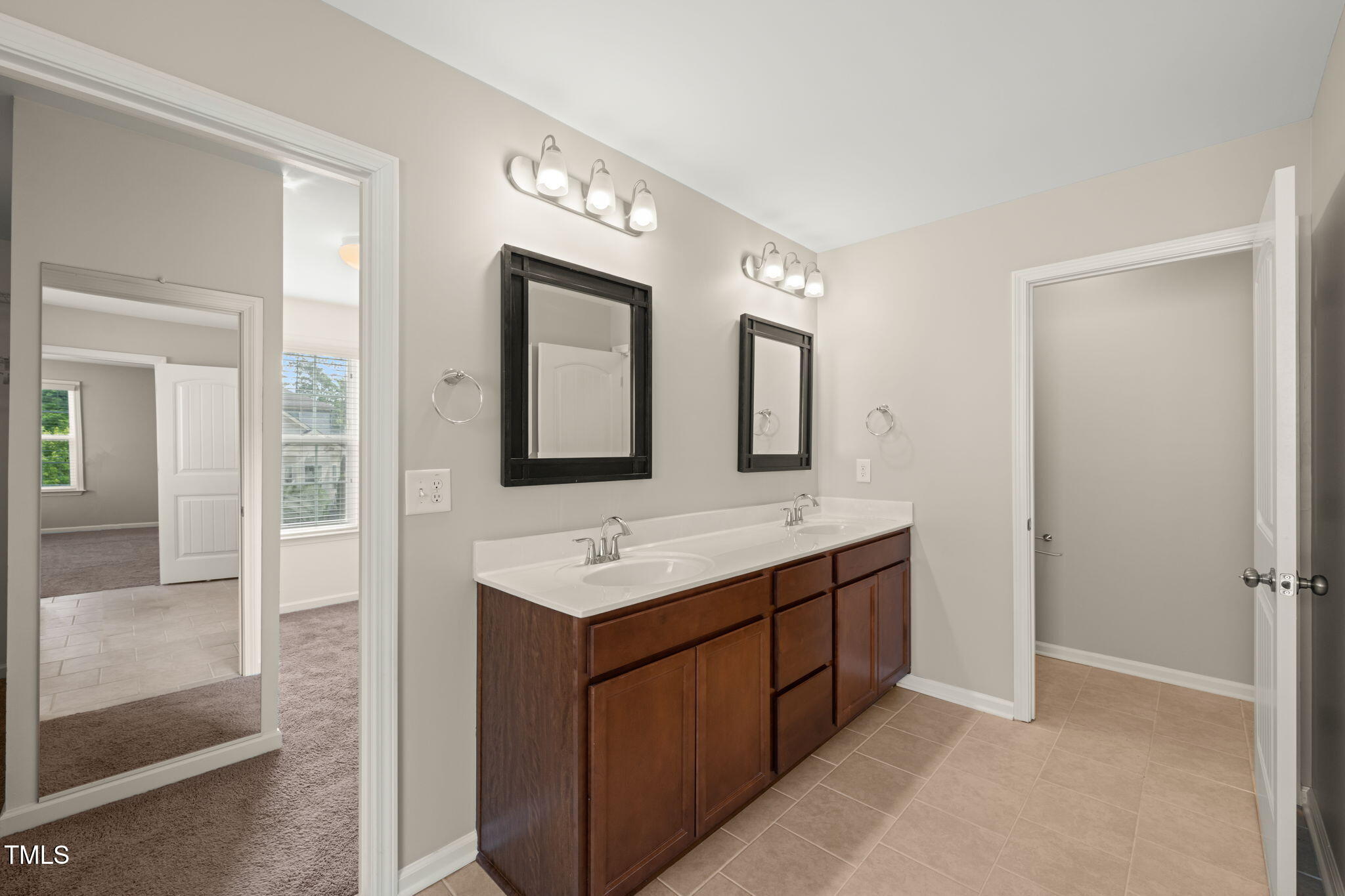 5011 Peachtree Town Lane Knightdale, NC 27545 - Photo 28 of 47 a bathroom with double sink and two mirror