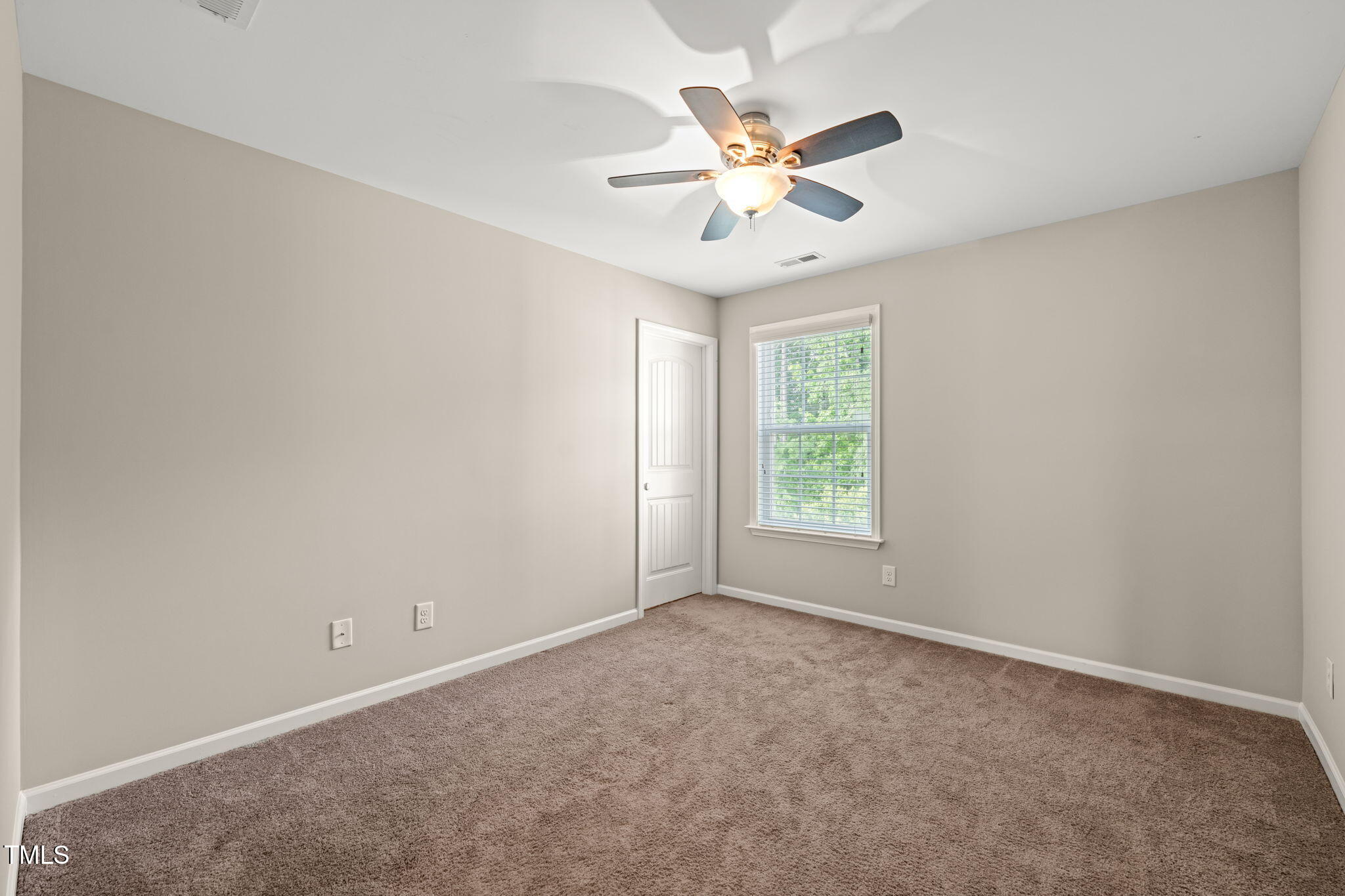 5011 Peachtree Town Lane Knightdale, NC 27545 - Photo 36 of 47 an empty room with windows and fan